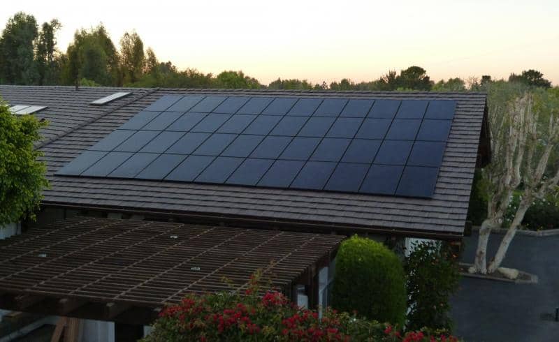 Tile roof solar installation at sunset